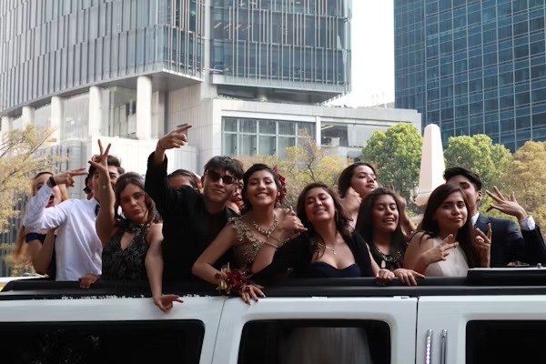 Happy customers enjoying luxury limousine service from cargoroute.pro during a memorable event.